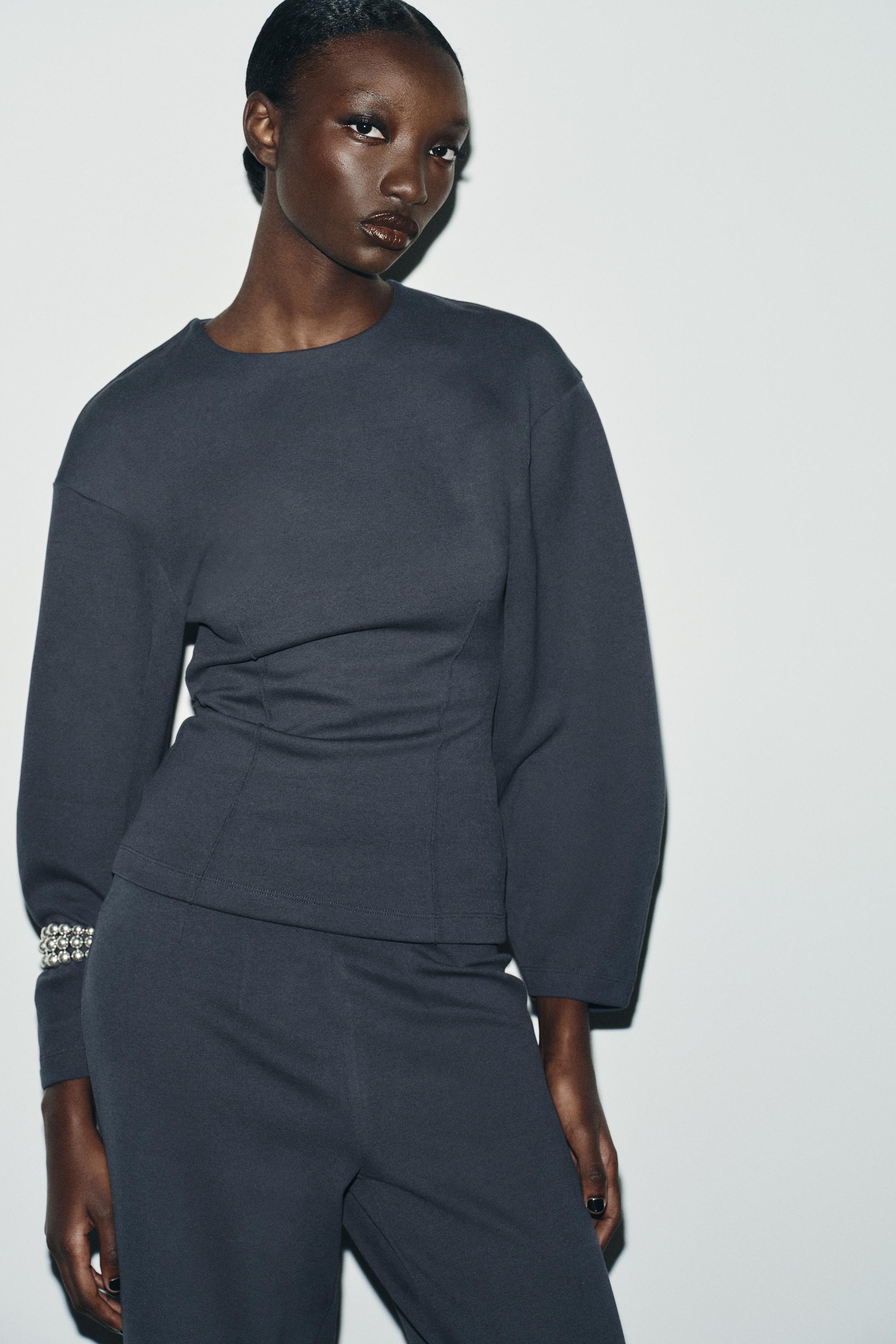 INTERLOCK JUMPER WITH DARTS